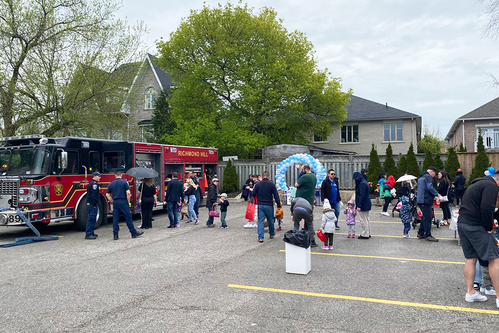a group of people standing in the SickKids event at Lullaboo